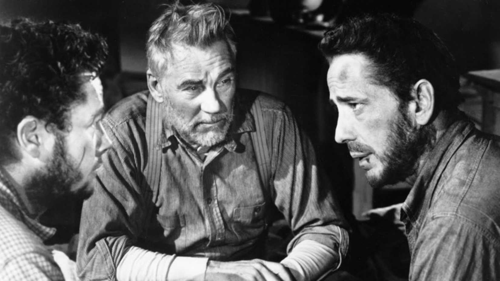 The three men talk in The Treasure of the Sierra Madre