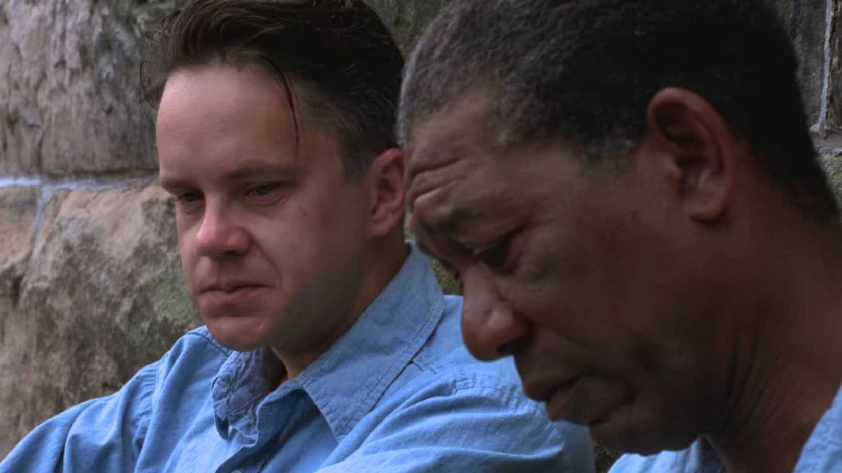 Tim Robbins as Andy talking to Morgan Freeman as Red in the yard in The Shawshank Redemption