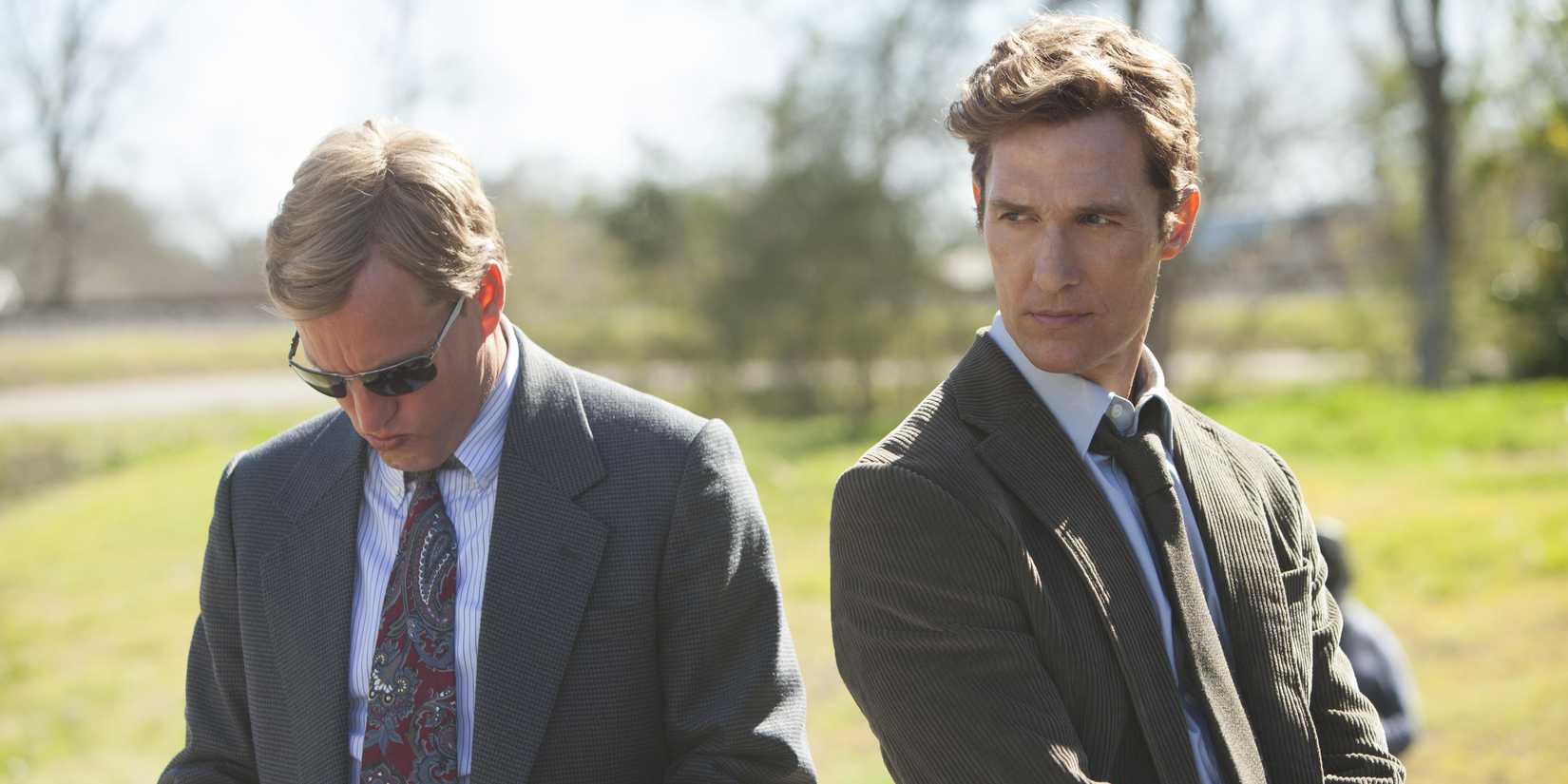 Marty (Woody Harrelson) and Rust (Matthew McConaughey) standing outside on True Detective