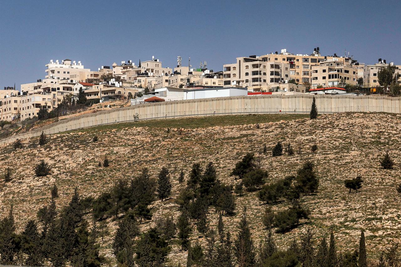 The West Bank village of al-Ram is pictured behind Israel