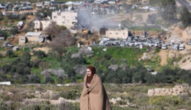 A Palestinian woman reacts as Israeli bulldozers demolish an apartment building belonging to the Salhab family near the Israeli settlement of Hagai, south of the occupied West Bank city of Hebron, on Feb. 18, 2026. (AFP Photo)
