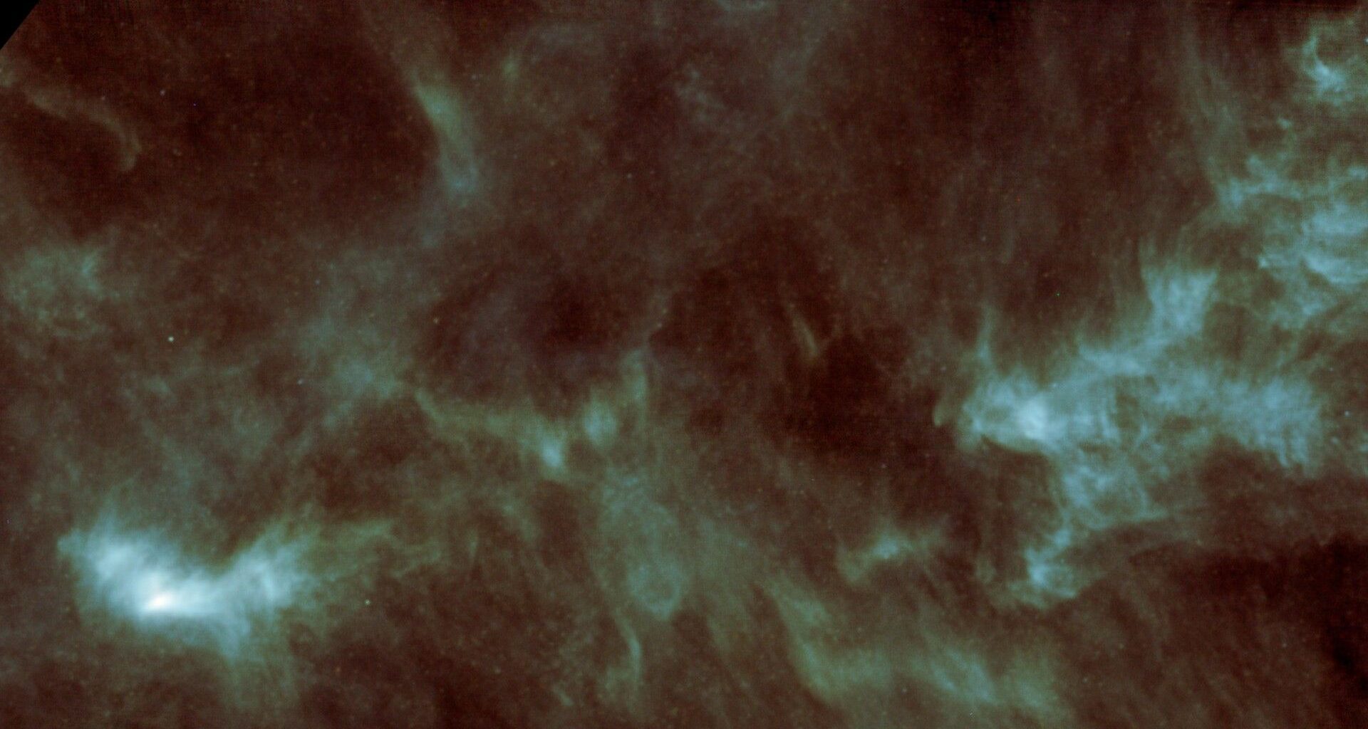 a pale green cloud of gas on a starry background