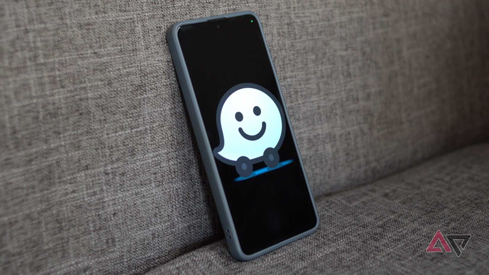 Waze logo on a phone screen