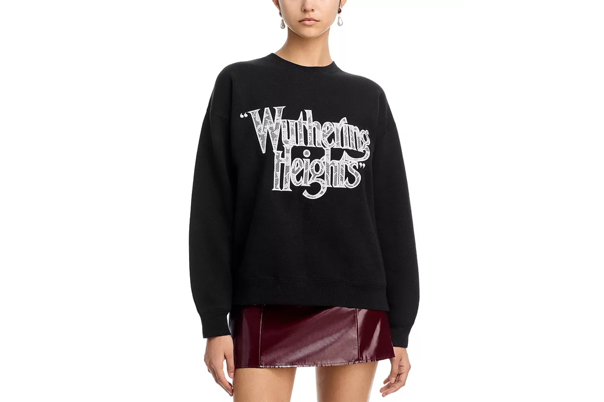 Black sweatshirt with "Wuthering Heights" in white lettering, paired with a burgundy leather mini-skirt.