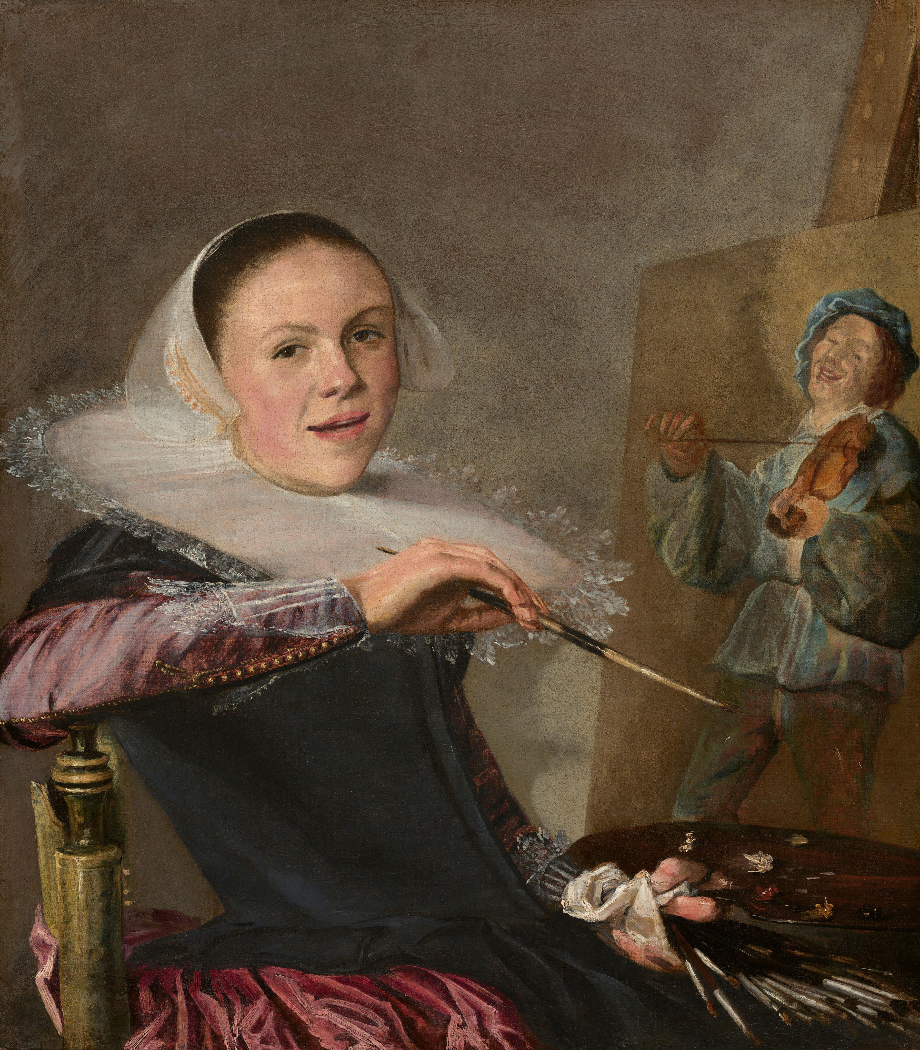 A young woman with a white ruff and bonnet holds paintbrushes and a palette, looking at the viewer while sitting in front of an easel with a painting of a man playing a violin.