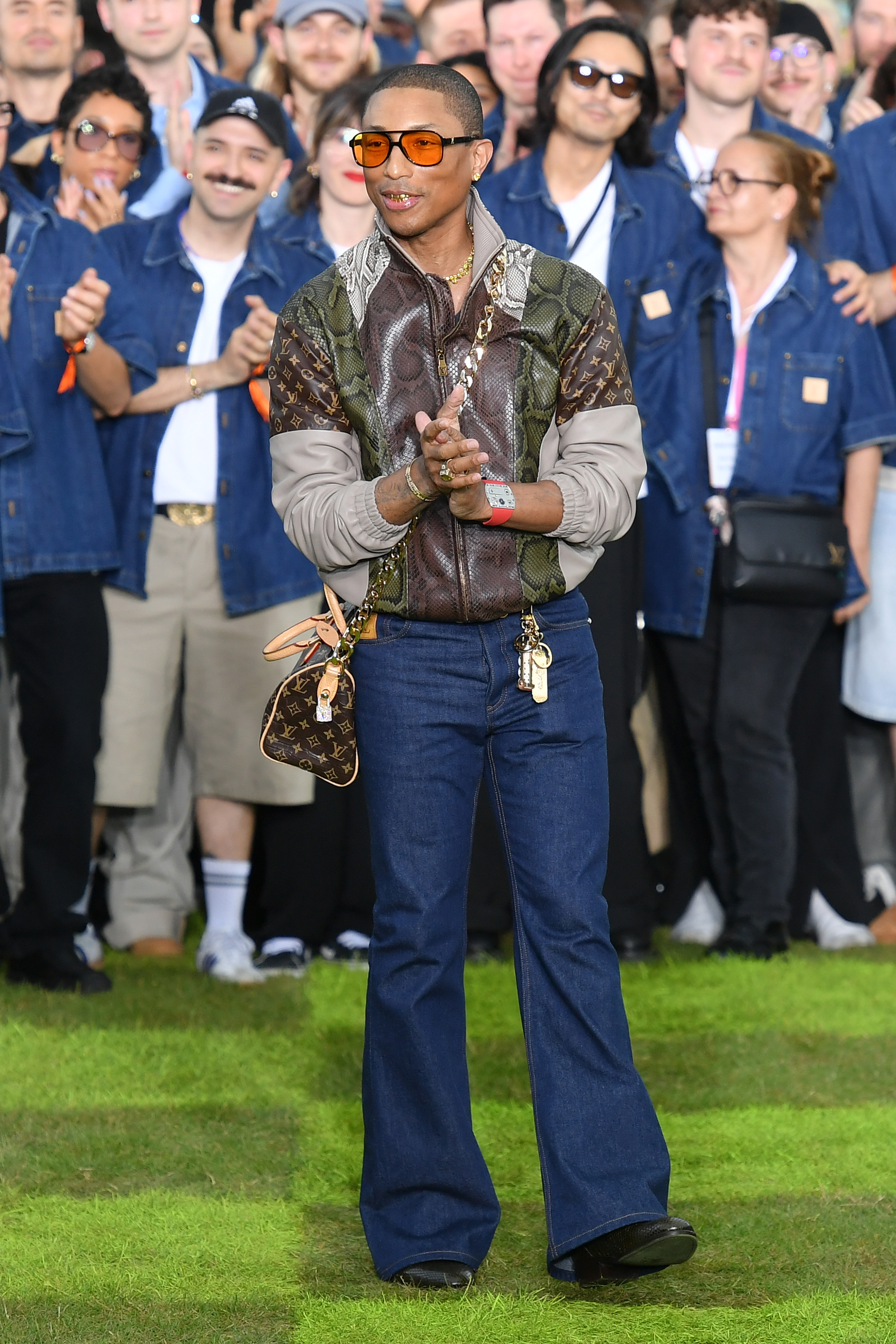 Pharrell Williams walking the runway during the Louis Vuitton Menswear Spring/Summer 2025 show.