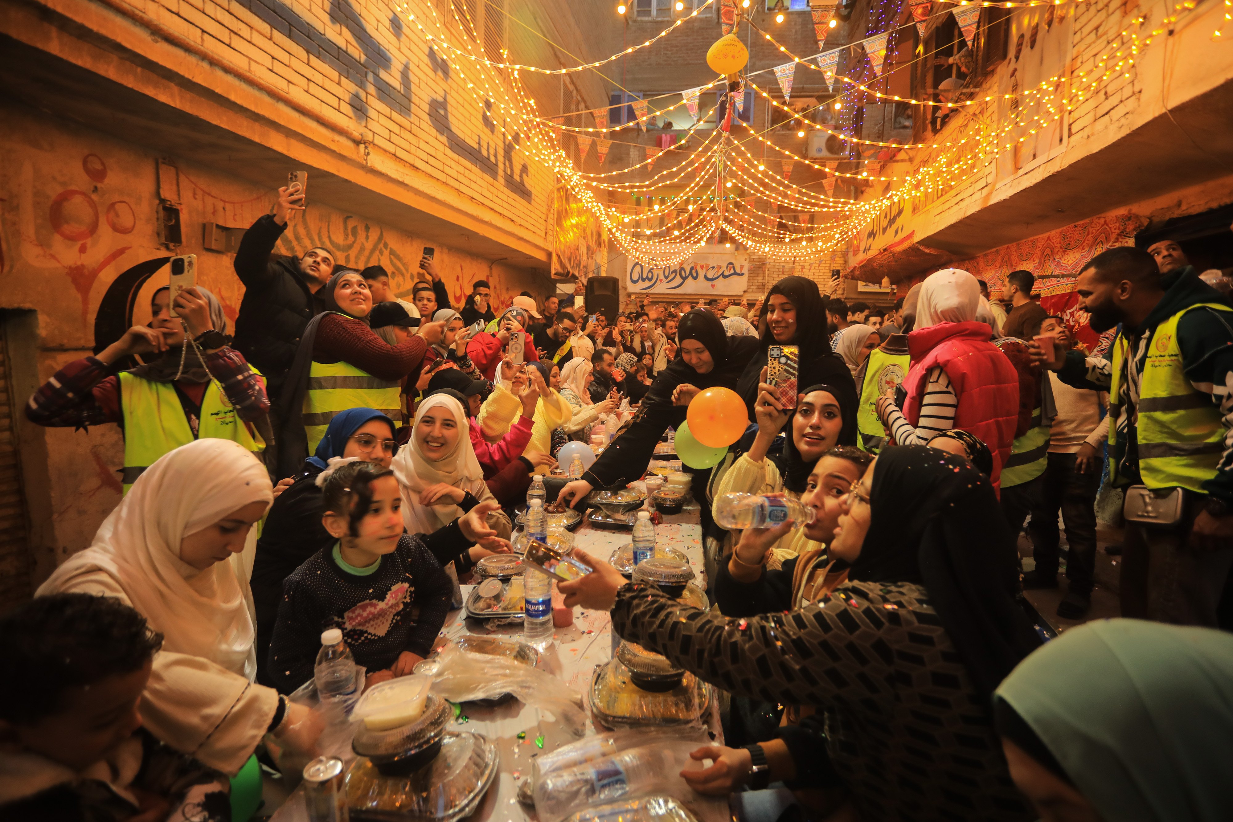 Muslims in Cairo gather for a communal iftar meal during Ramadan.