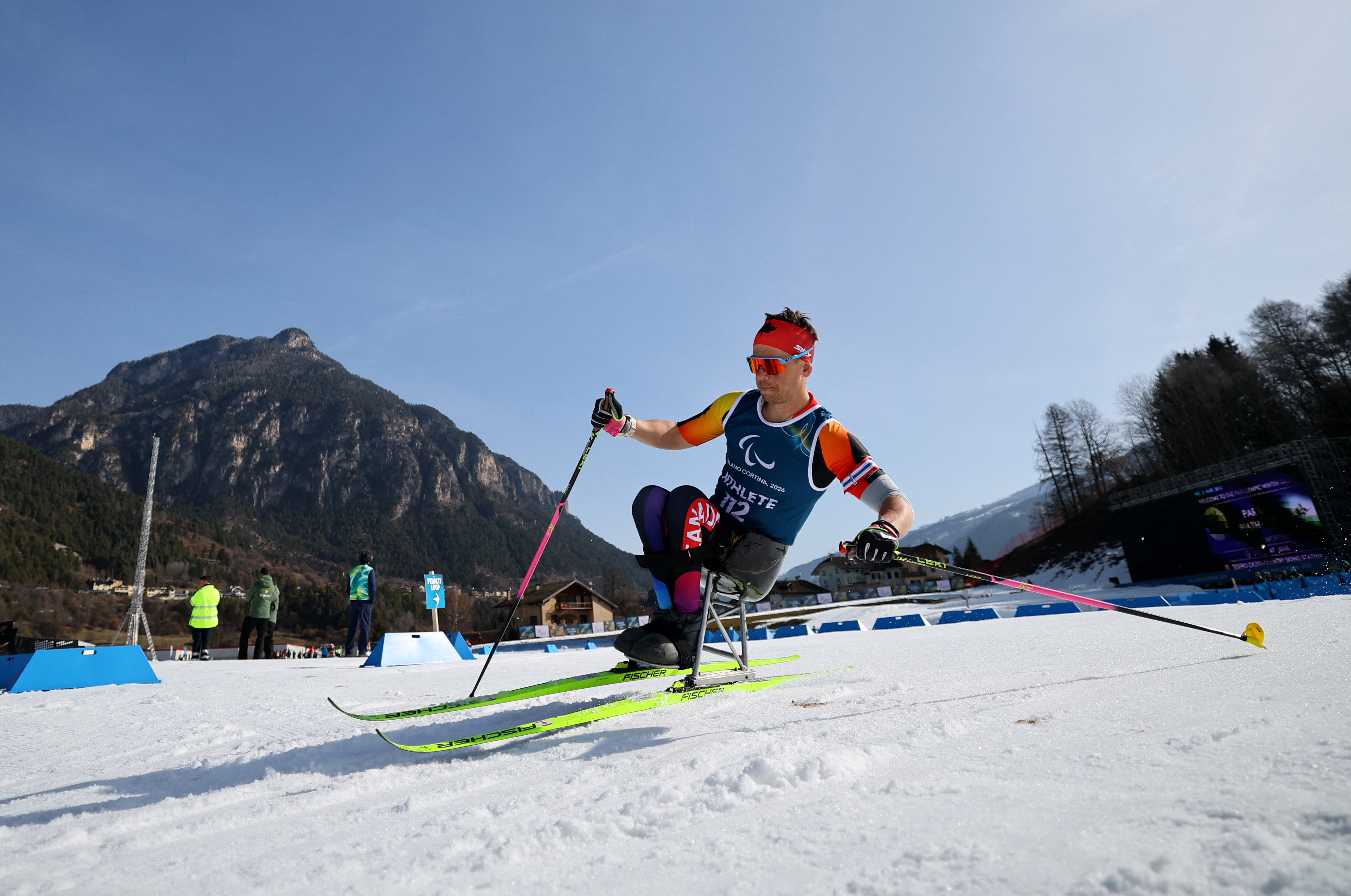 Derek Zaplotinsky of Canada practices para biathlon in a sit-ski during training at the Tesero Cross-Country Skiing Stadium.