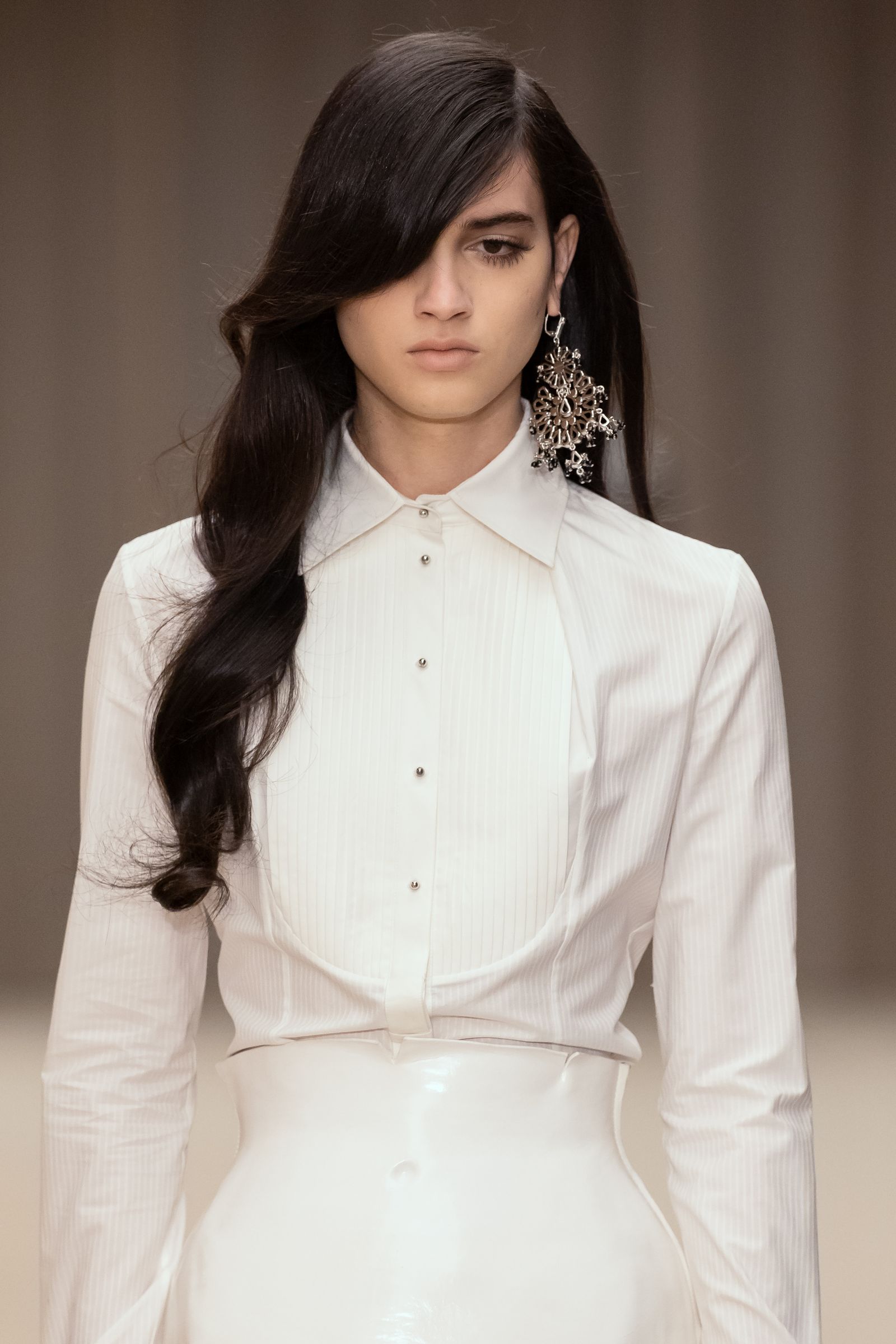 Image may contain Black Hair Hair Person Adult Head and Face