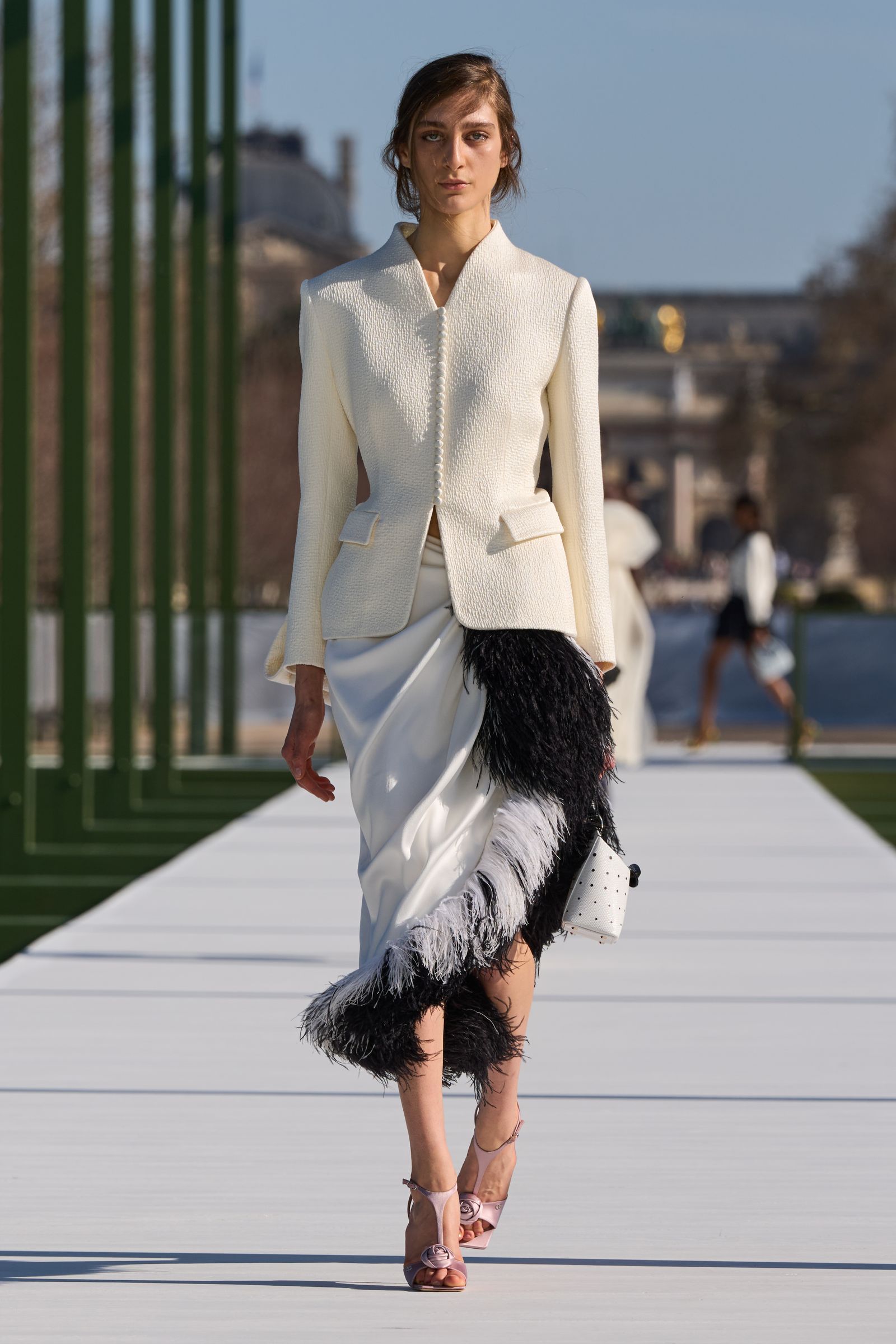 Image may contain Clothing Coat Jacket Formal Wear Suit Blazer Person Skirt Adult Fashion Long Sleeve and Sleeve