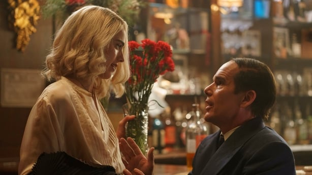 Margaret Qualley as Elizabeth Weiland and Ethan Hawke as Lorenz Hart share a moment in Blue Moon.