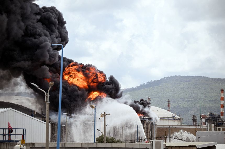 A fire blazes after an industrial building and a fuel tanker at Israel's Oil Refineries were hit by debris from an intercepted Iranian missile, on March 30.