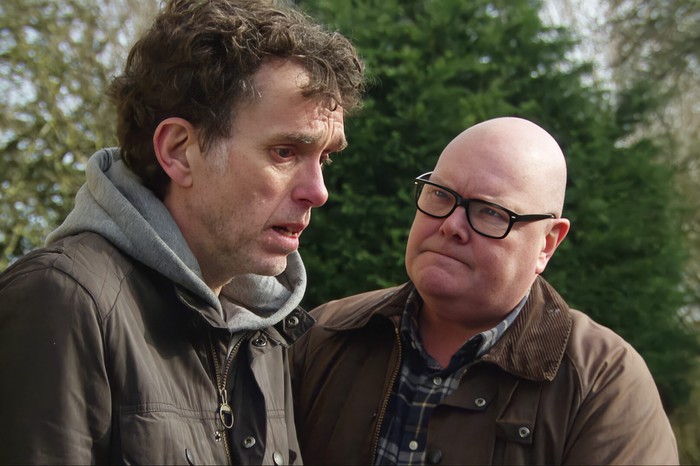 Paddy stares towards a broken Marlon in a scene from Emmerdale