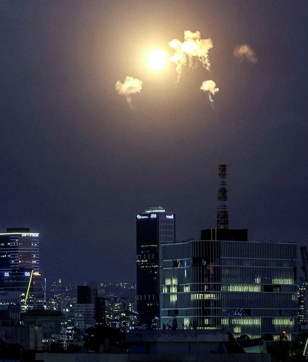 Explosions from projectile interceptions by Israel's Iron Dome over Tel Aviv on Saturday.