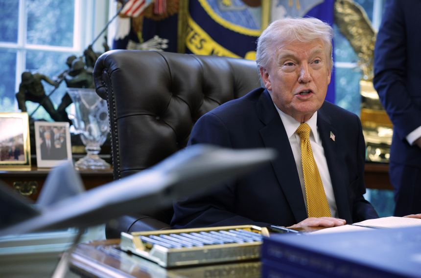 President Donald Trump in the Oval Office of the White House on March 16.