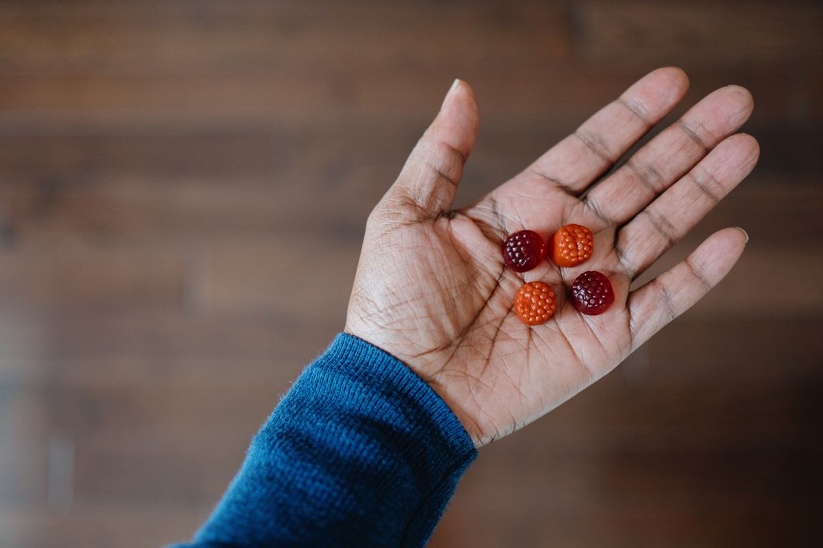 Person holding gummy supplements