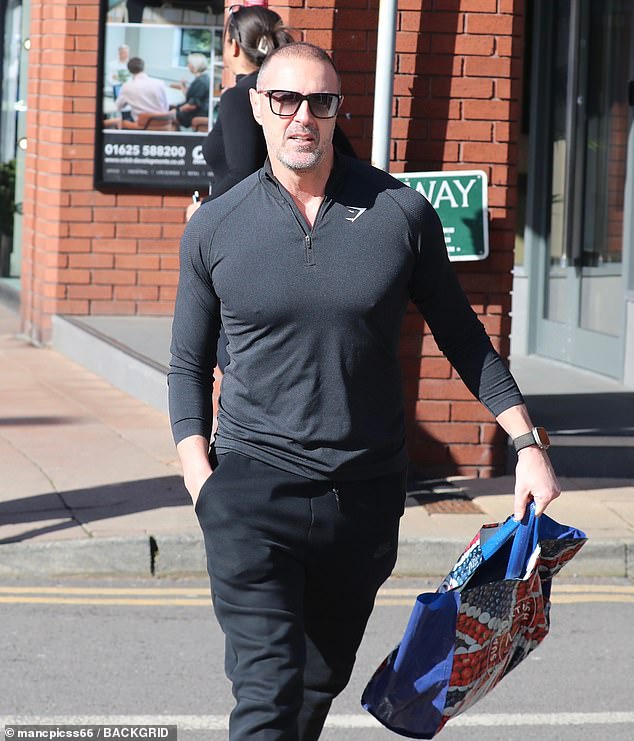 Paddy displayed his bulging muscles in a form-fitting black quarter zip top, teamed with matching joggers and a pair of white trainers on his outing in Cheshire