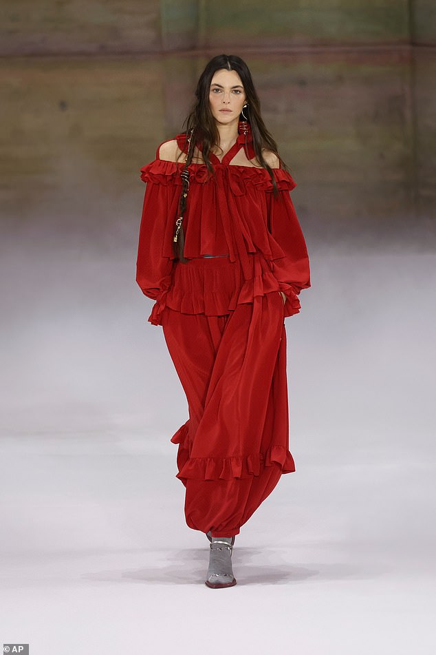 Model Vittoria Ceretti stormed the runway in an incredible red dress and grey boots