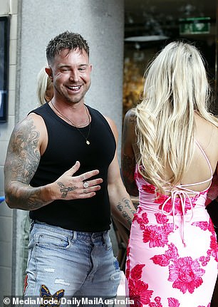 Farmer Chris appeared to be in good spirits as he hugged the birthday girl