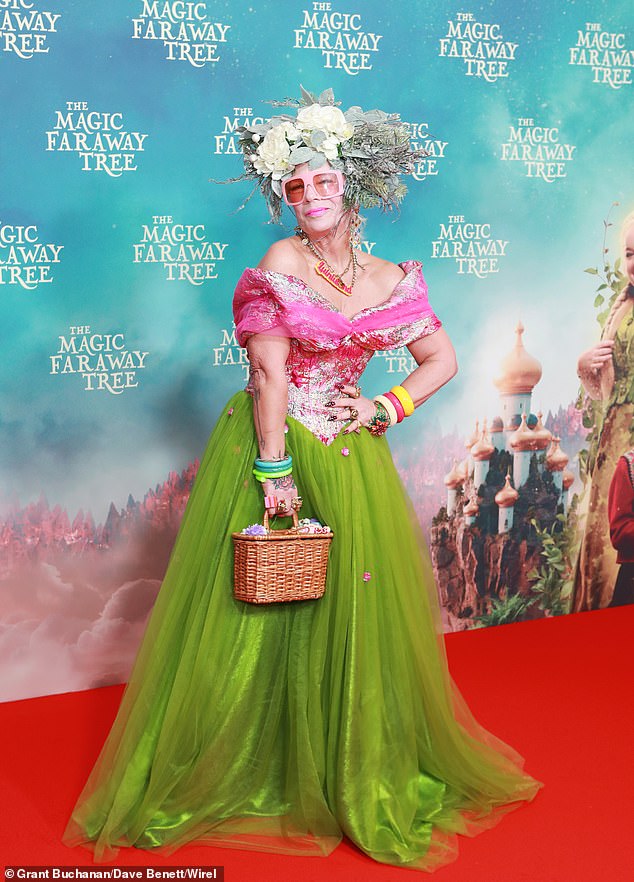 Lou Featherstone commanded attention in a bright pink-and-green ballgown and toted her belongings in a brown wicker bag