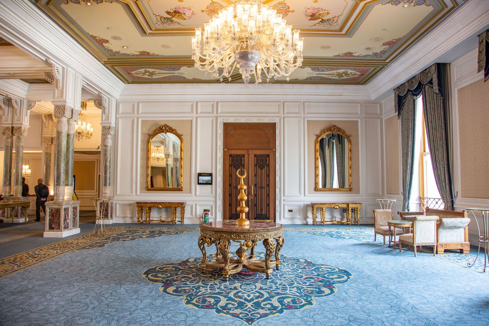 Image may contain Chandelier Lamp Home Decor Indoors Architecture Building Foyer Interior Design and Floor