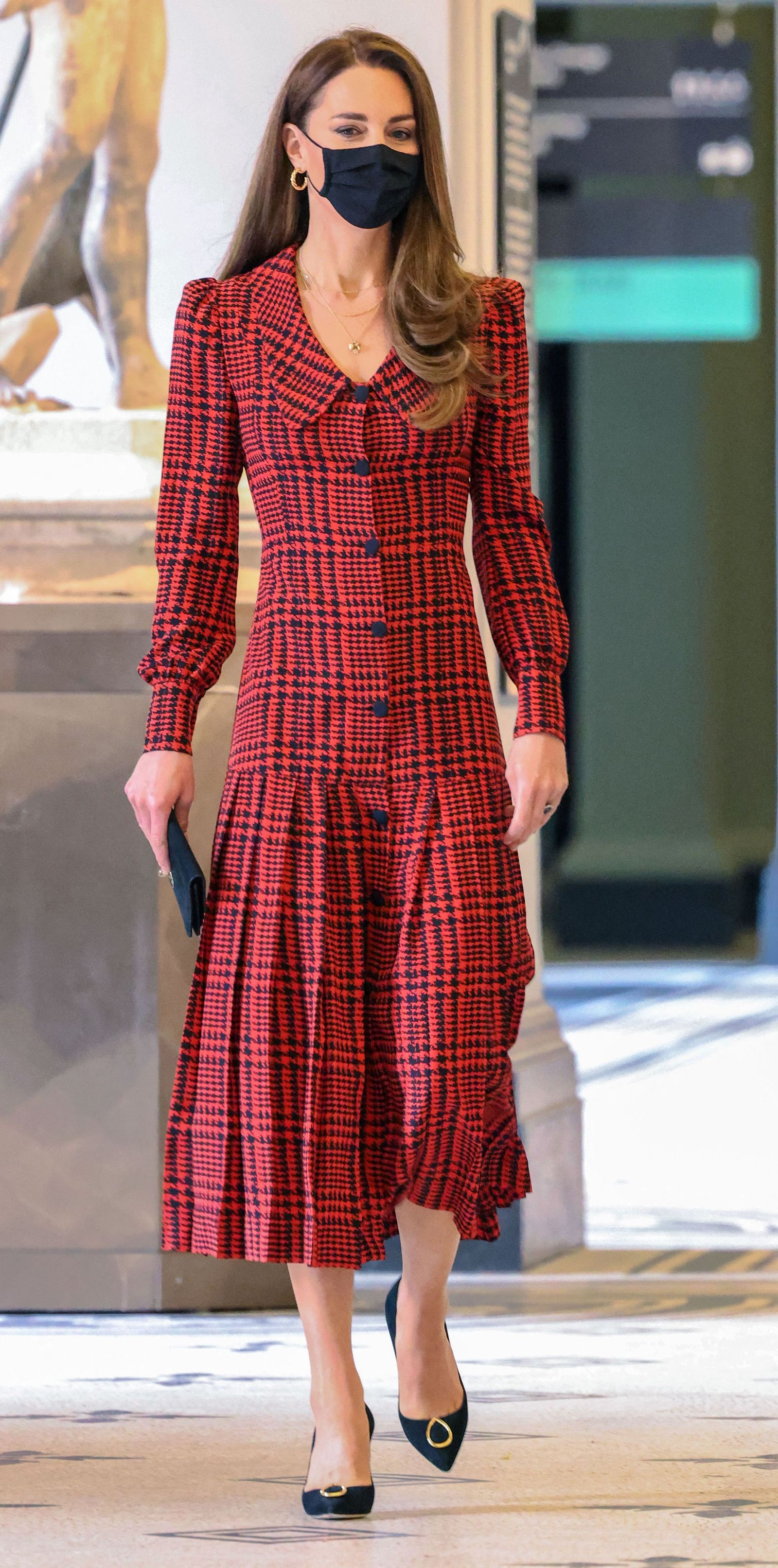 Britain's Catherine Duchess of Cambridge  wearing a face covering visits the Victoria and Albert  museum in London on...