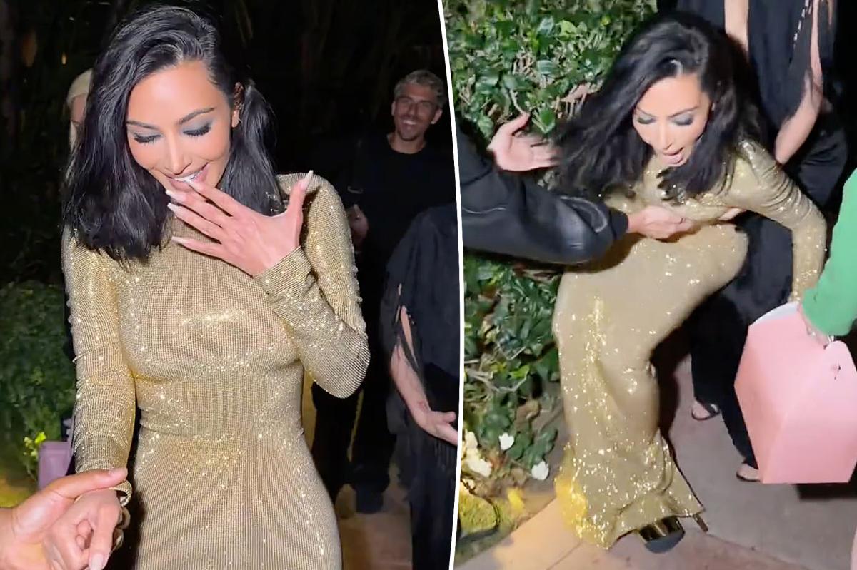 Kim Kardashian takes a tumble in 8-inch heels while walking into Vanity Fair Oscars Party 2026
