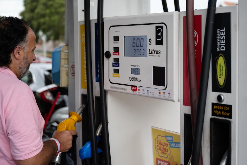 A man fuels up at a petrol station in Sydney