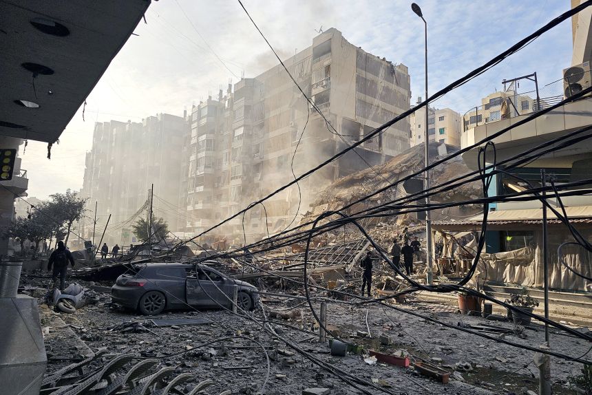 People inspect destruction at the site of an Israeli airstrike that targeted Mar Mikhael neighborhood in the southern suburbs of Beirut, Lebanon, on March 6, 2026.