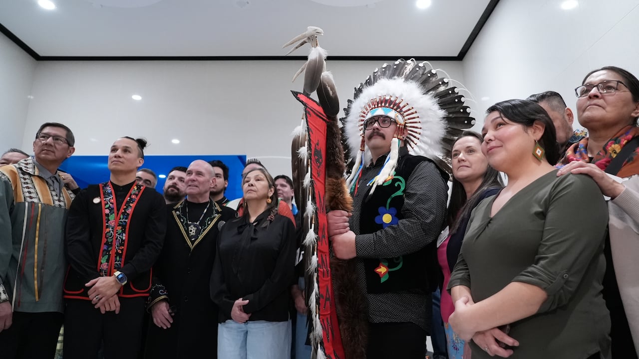 A group of people stares into the camera.