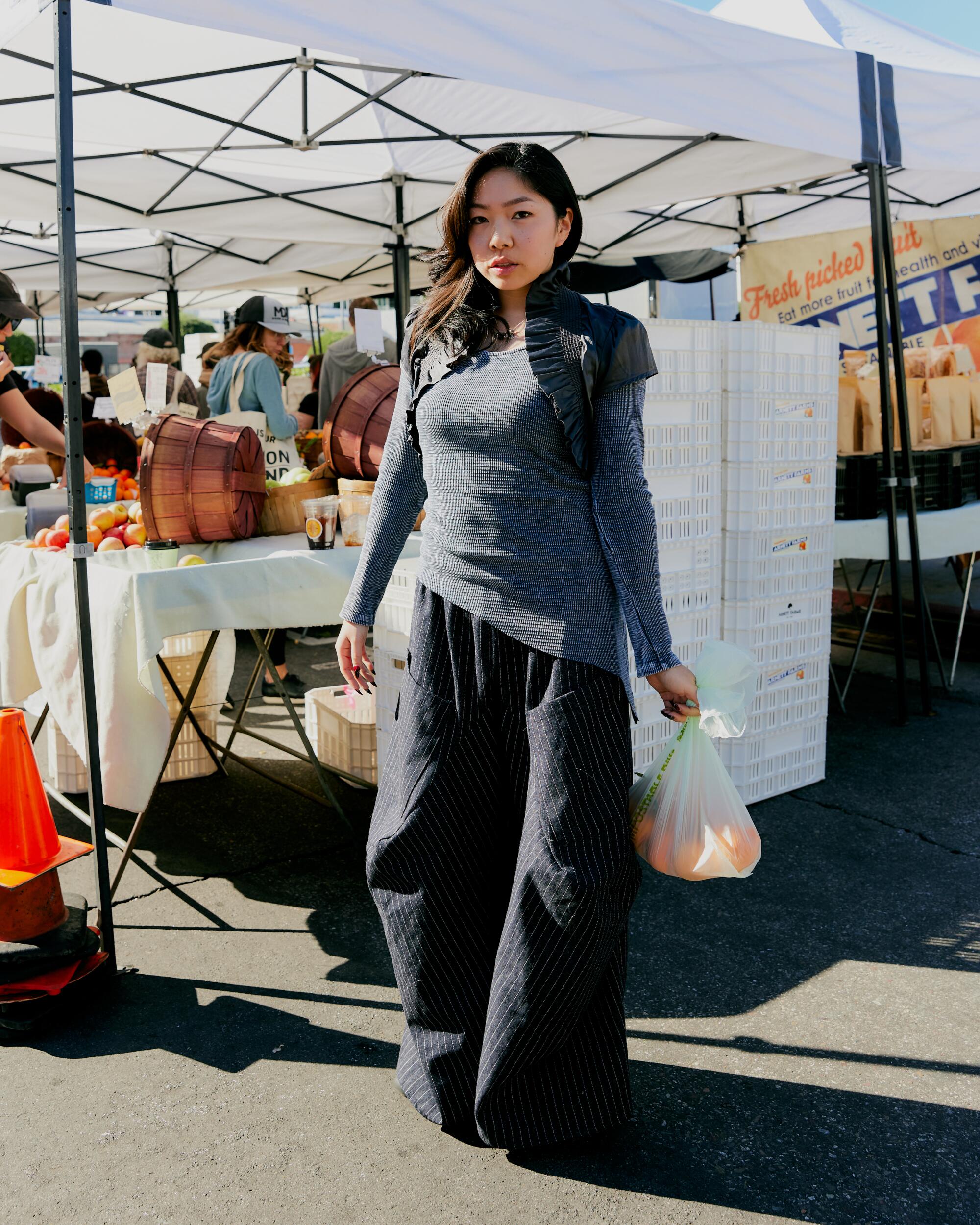 Audrea Wah wears thrifted dress and top, customized by herself, pants from Santee Alley and Fumsup Silver necklace.