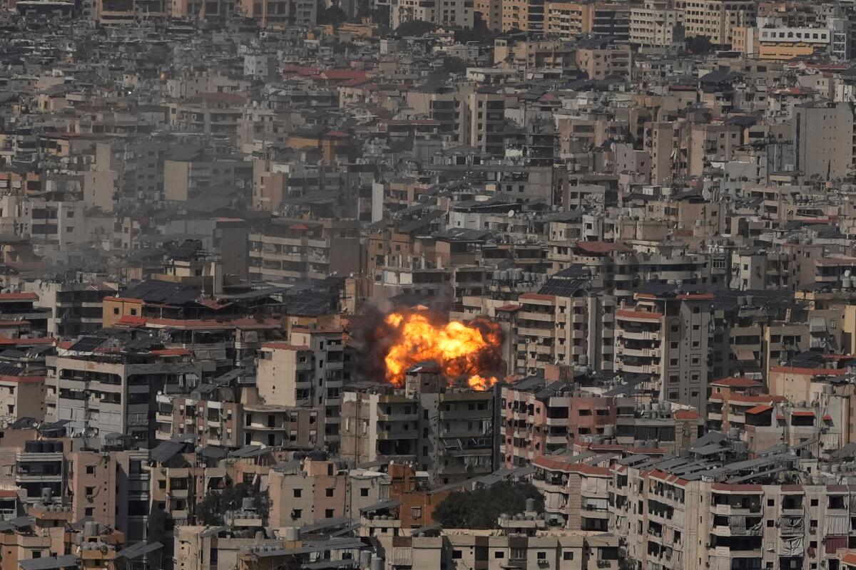 A fireball erupts in a sea of buildings