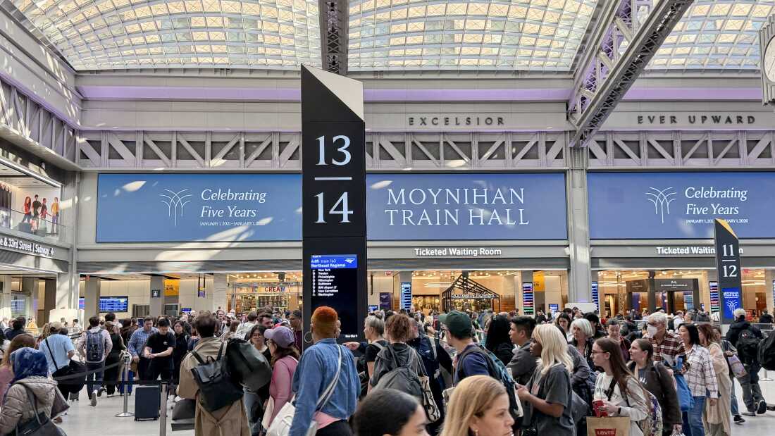 Commuters walk through Moynihan Train Hall in New York Penn Station in New York on March 9.