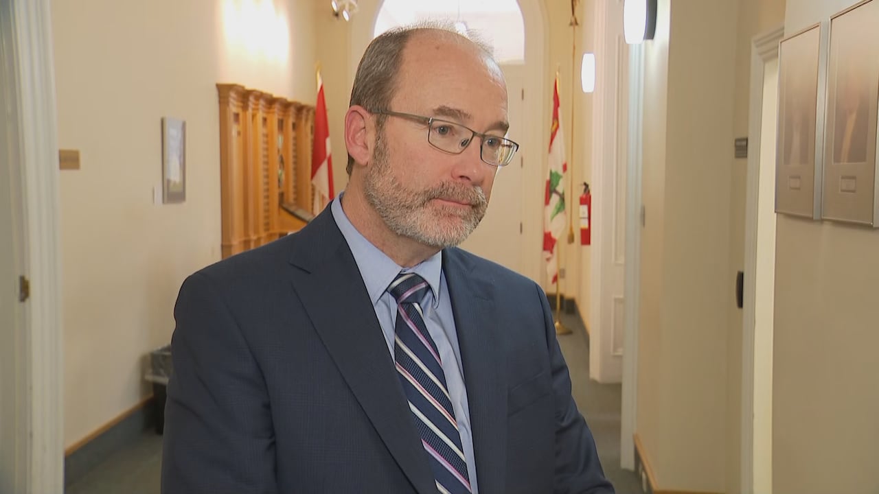 A man in a blue suit.