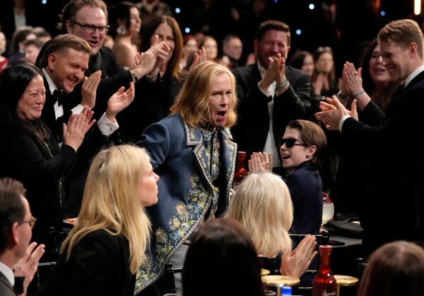 Amy Madigan, center, reacts to winning the award for best supporting actress for "Weapons" during the 31st Annual Critics Choice Awards in Santa Monica, Calif., on Jan. 4, 2026. (AP Photo/Chris Pizzello, File)