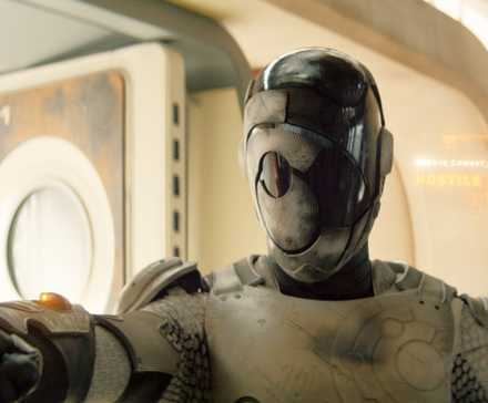 Alexander Skarsgard as Murderbot with its helmet down and text reading 