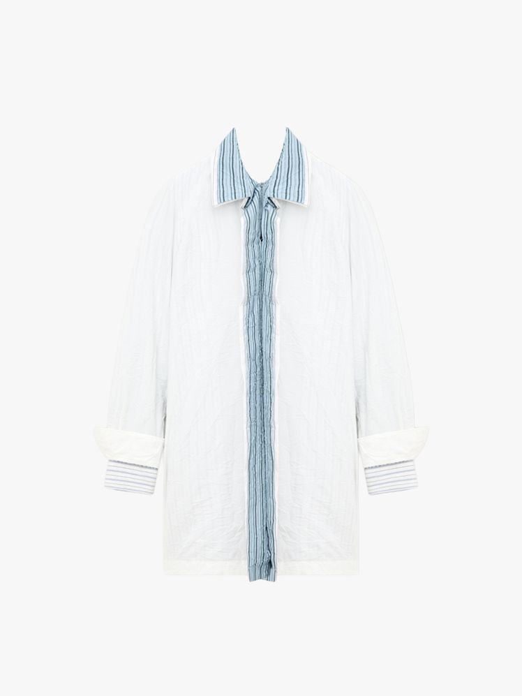 Image may contain: Clothing, Coat, Home Decor, Linen, Long Sleeve, Sleeve, and Lab Coat