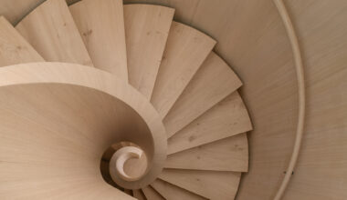 Transforming a Concrete Shell into a Wooden Interior Shaped by the Sea