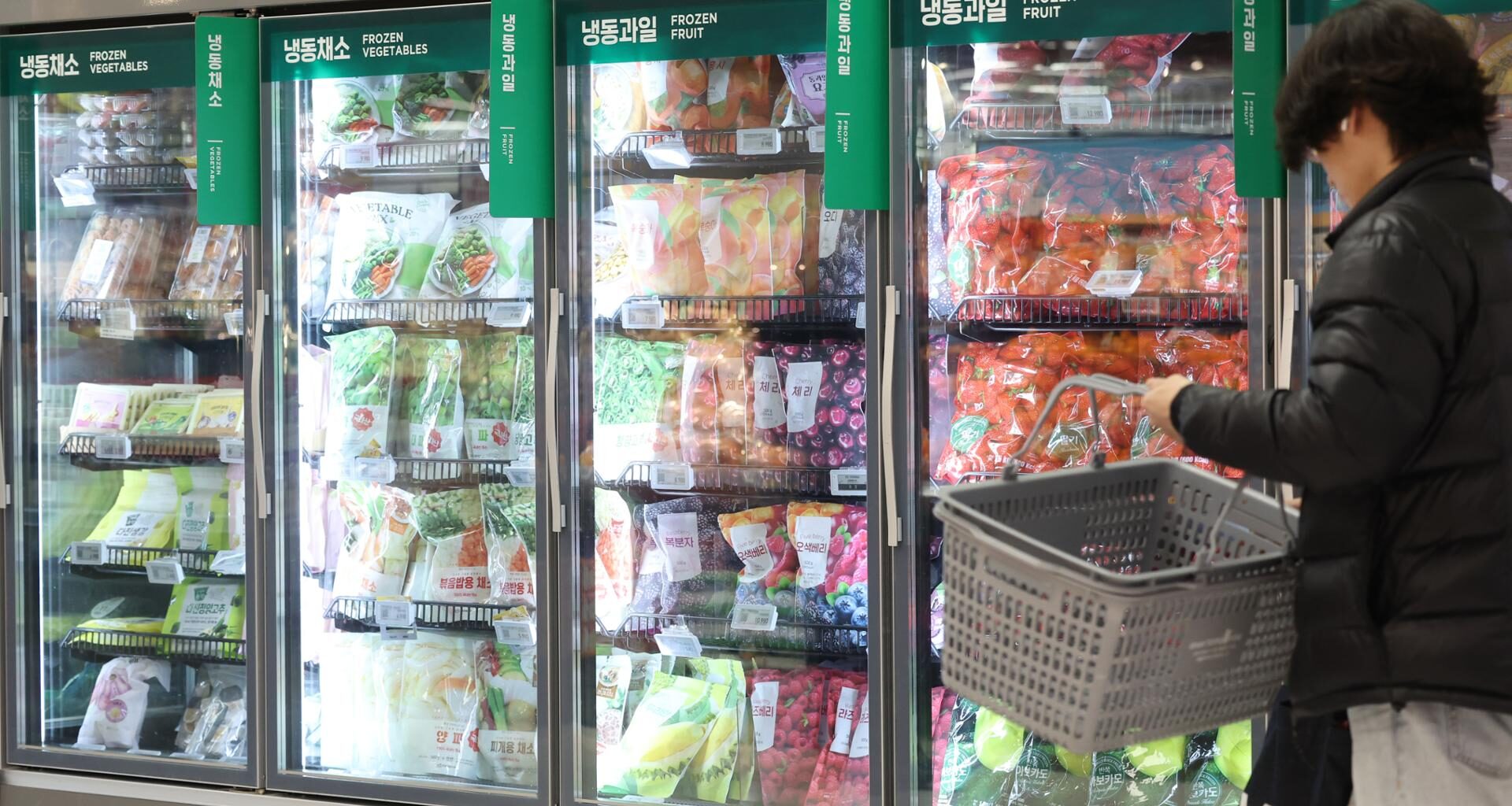 A shopper walks down the frozen aisle at a supermarket in Seoul. Yonhap