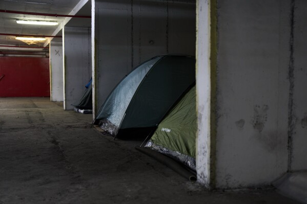 Tents are seen set up beneath Tel Aviv's central bus station, where people shelter as a precaution against possible Iranian missile attacks, Thursday, March 12, 2026. (AP Photo/Oded Balilty)