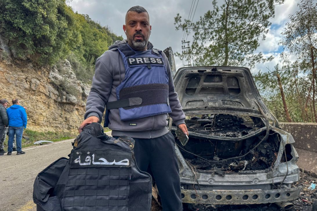 Al Mayadeen journalist Jamal Al-Gharabi holds the press vest of one of the Lebanese journalists who were killed in a targeted Israeli strike in Jezzine in southern Lebanon, March 28, 2026.