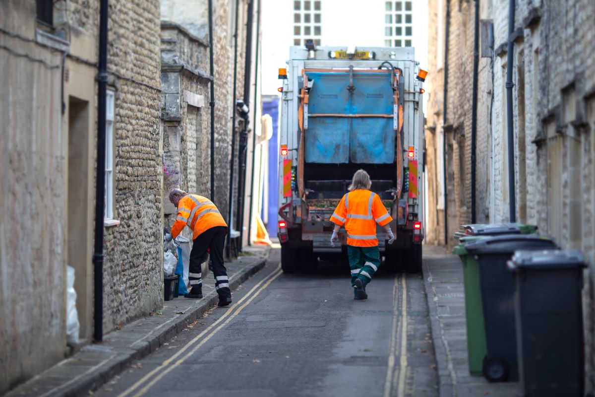 10th October, 2018 - Garbage men collecting household waste and recycling in the Market Town of Cirencester, in The Cotswolds