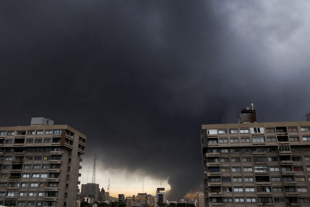 Smoke rises after a reported strike on fuel tanks at an oil refinery, amid the U.S.-Israeli conflict with Iran, in Tehran