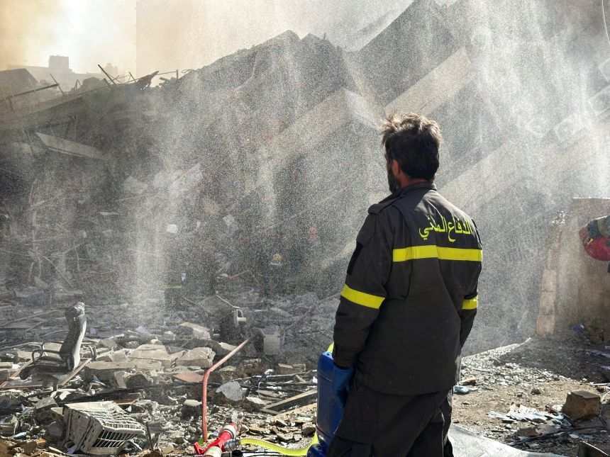 A member of the Lebanese Civil Defence inspects a damaged building after an Israeli strike on Beirut's southern suburbs on March 9, 2026.
