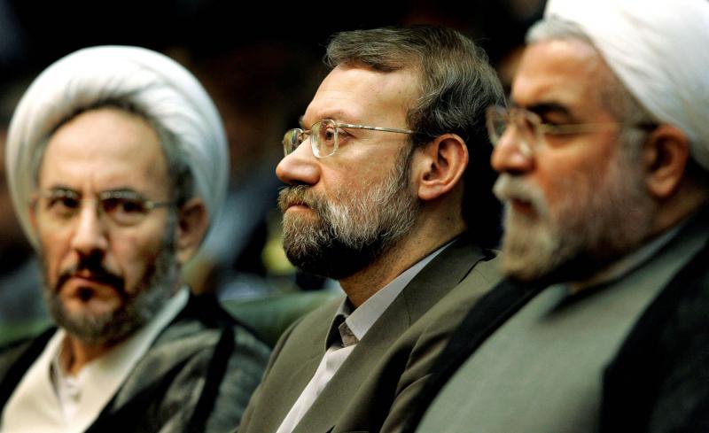 Iran’s former Intelligence Minister Ali Younesi (L), then-chief nuclear negotiator Ali Larijani (C) and former chief nuclear negotiator Hassan Rouhani (R) at a conference on Iran’s Nuclear Policies and Prospects in Tehran April 25, 2006.