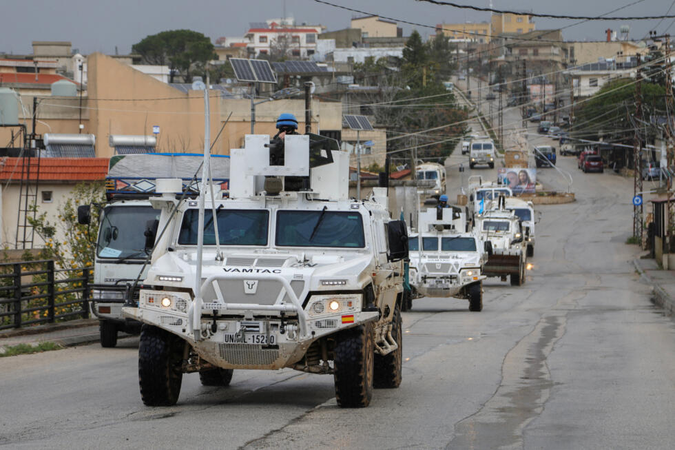 UNIFIL vehicles drive on a main road in Qlayaa, southern Lebanon on March 27, 2026