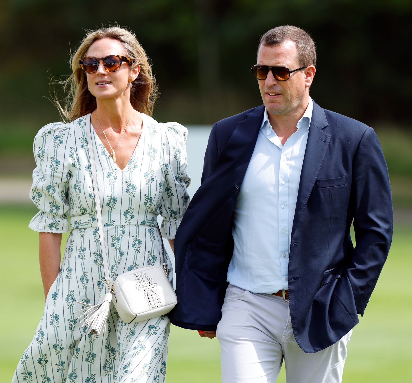 Image may contain Blazer Clothing Coat Jacket Adult Person Accessories Jewelry Necklace Glasses and Body Part