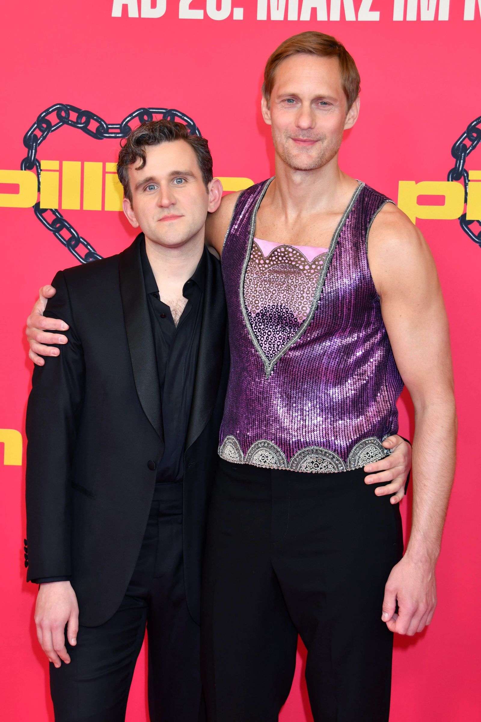 Image may contain Alexander Skarsgård Harry Melling Fashion Adult Person Wedding Blazer Clothing Coat and Jacket