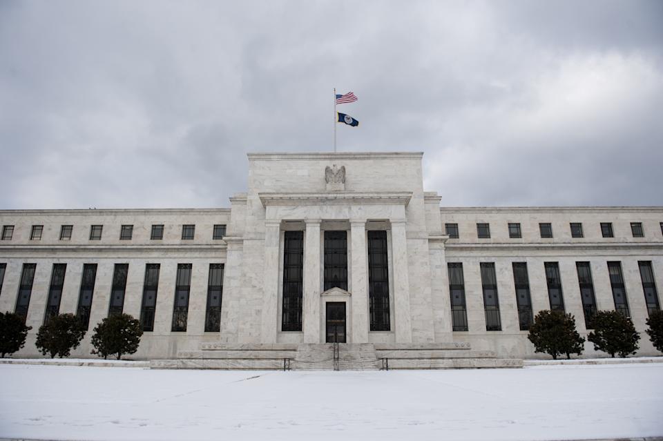 Snow covers the front of the Federal Reserve in Washington, DC, on January 27, 2011, the day after a snowstorm dropped 5-8 inches of snow in the region. AFP PHOTO / Saul LOEB (Photo credit should read SAUL LOEB/AFP via Getty Images)
