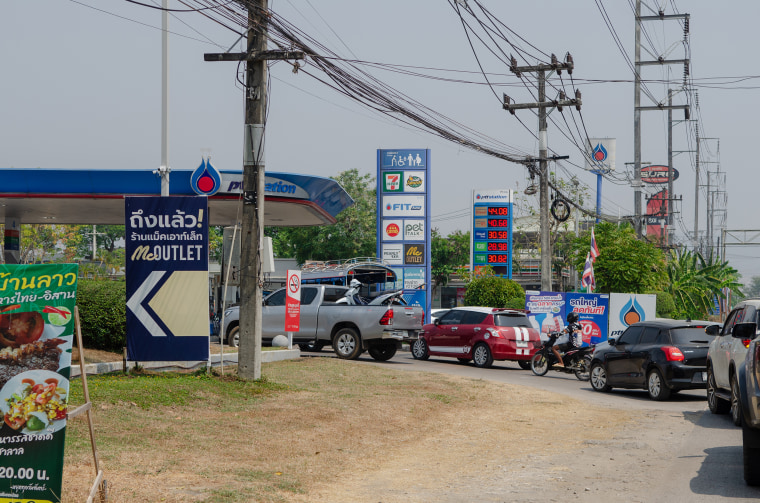 Long queues of vehicles line the road in Mae Sot, waiting